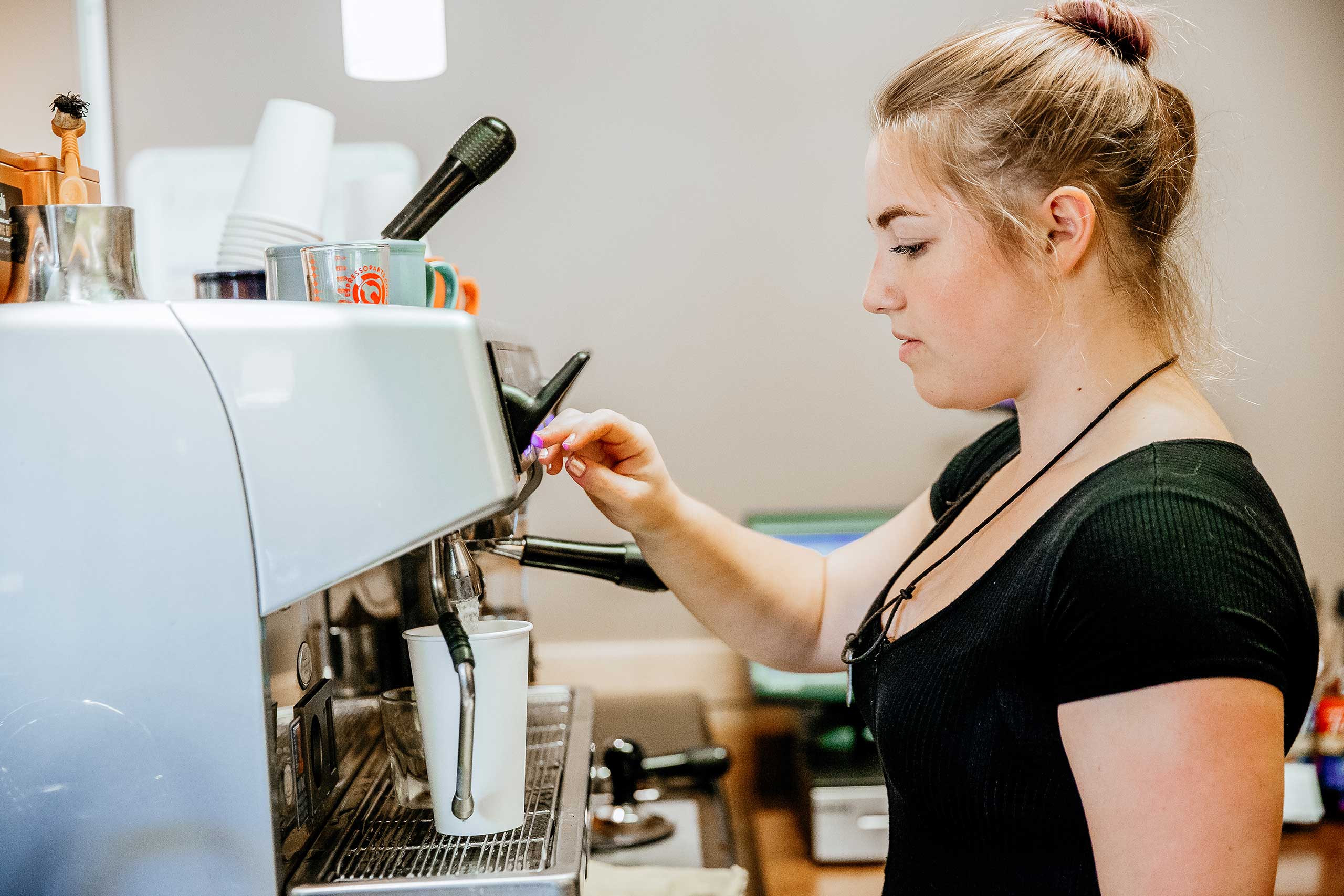 Barista making coffee